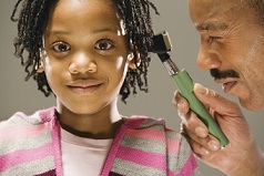young girl getting hearing checked