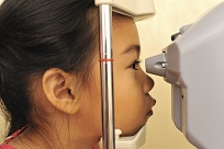young girl getting vision checked.